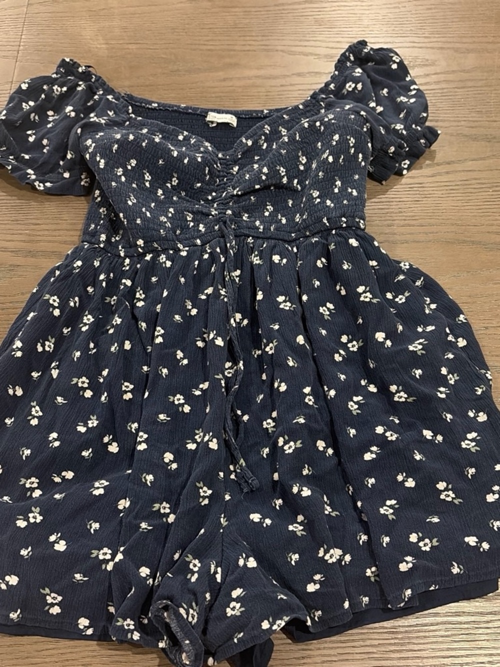 Navy Hollister Floral Smocked Romper with Puff Sleeves